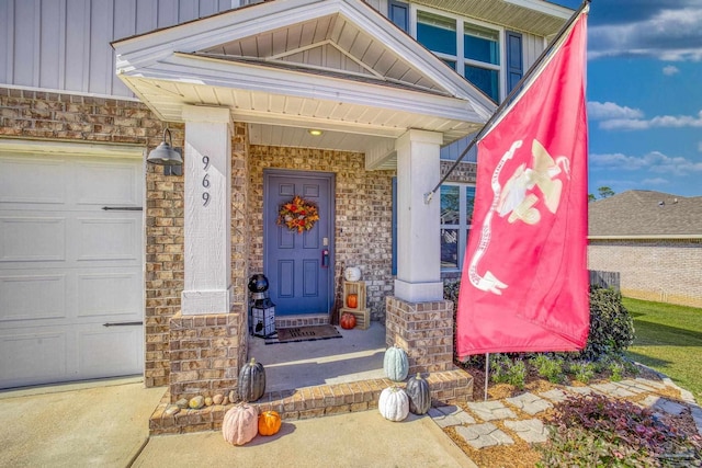 doorway to property featuring a garage