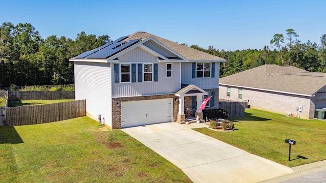 view of front of home featuring a front yard and a garage