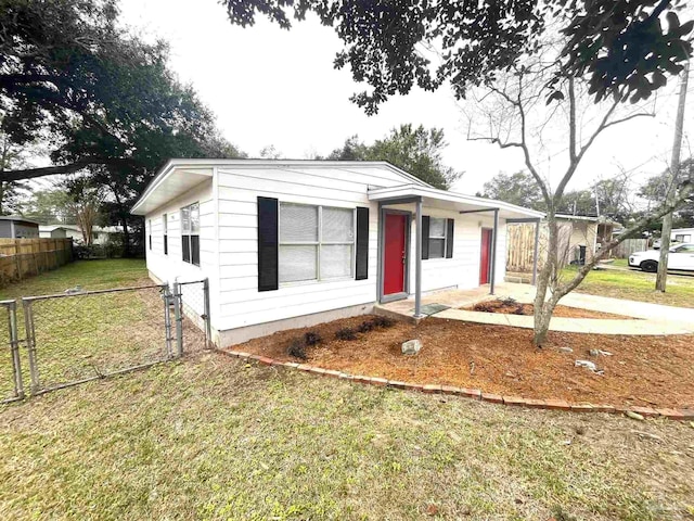 bungalow featuring a front yard and fence