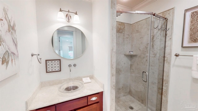bathroom featuring a shower stall and vanity