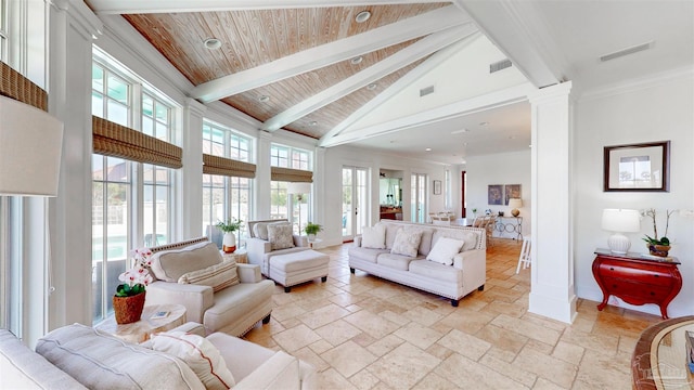 living area featuring high vaulted ceiling, visible vents, beam ceiling, decorative columns, and stone tile floors
