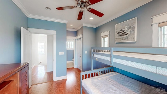 bedroom with ornamental molding, baseboards, recessed lighting, and wood finished floors