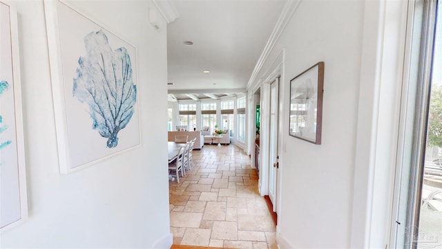corridor with baseboards, ornamental molding, stone tile flooring, and recessed lighting