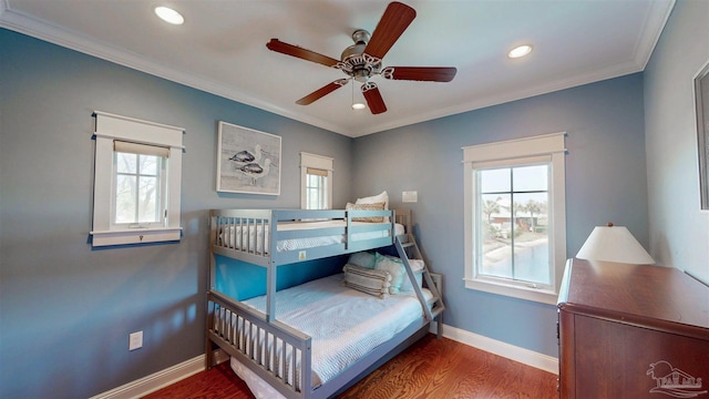 bedroom with crown molding, baseboards, recessed lighting, and wood finished floors