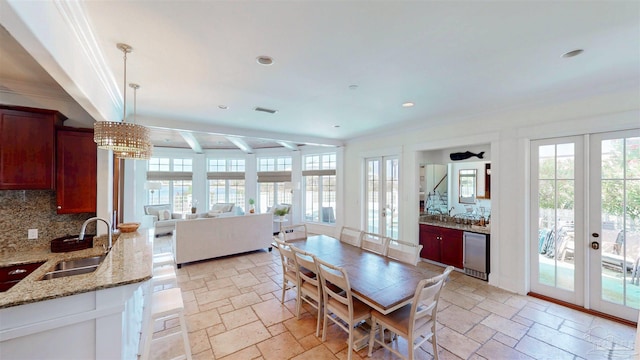 dining room featuring recessed lighting, french doors, crown molding, stone tile flooring, and visible vents