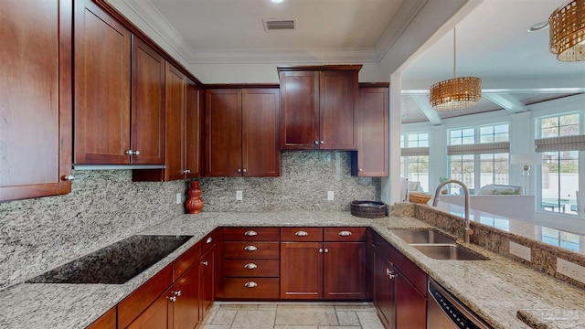 kitchen with a sink, visible vents, tasteful backsplash, and light stone countertops