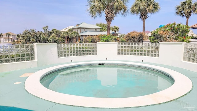 view of swimming pool with fence