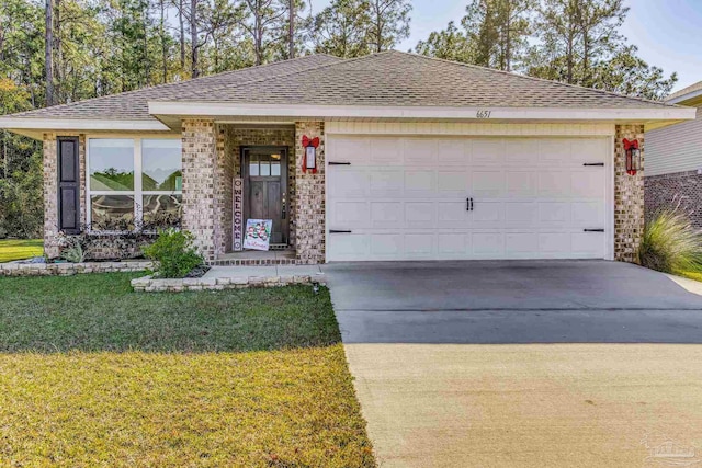 view of front of house featuring a front yard and a garage