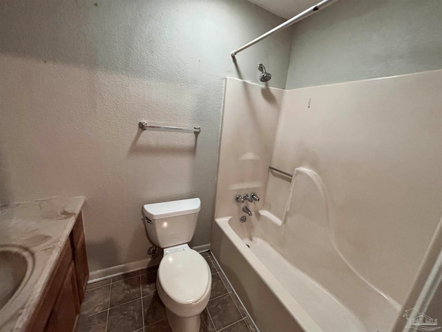 full bathroom featuring toilet, shower / bath combination, vanity, baseboards, and tile patterned floors