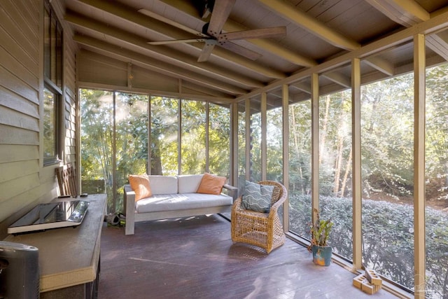 sunroom / solarium featuring ceiling fan and vaulted ceiling