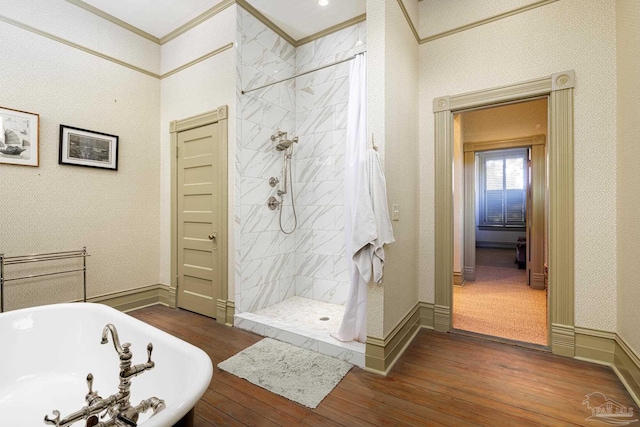 bathroom featuring hardwood / wood-style floors, crown molding, and independent shower and bath