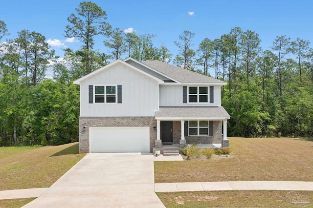 view of front of property with a garage and a front yard