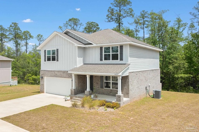 view of front of property with a porch, a garage, a front yard, and cooling unit