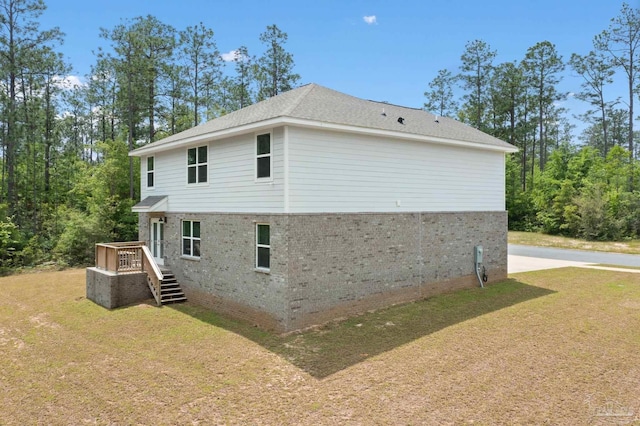 view of home's exterior with a lawn