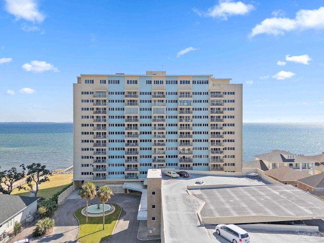 view of building exterior with a water view