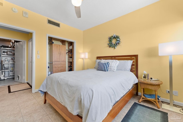 bedroom featuring a closet, ceiling fan, and a spacious closet