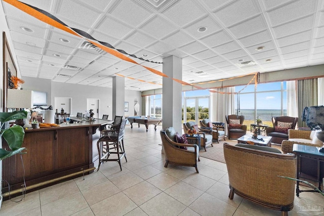 interior space with pool table, a water view, and bar area