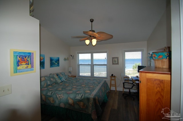 bedroom with lofted ceiling, dark hardwood / wood-style flooring, and ceiling fan