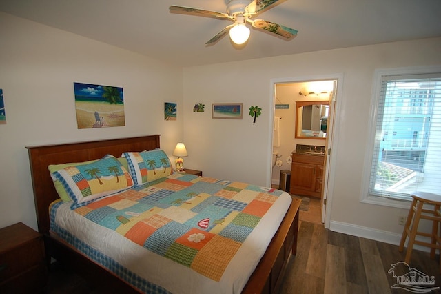 bedroom with multiple windows, dark hardwood / wood-style floors, ceiling fan, and ensuite bathroom