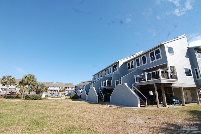 back of house with a lawn