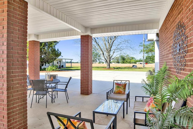view of patio with outdoor dining area