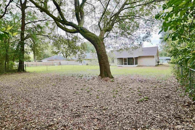 view of yard with fence