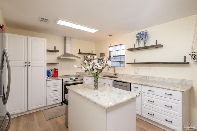 kitchen with visible vents, open shelves, stainless steel appliances, a sink, and wall chimney exhaust hood