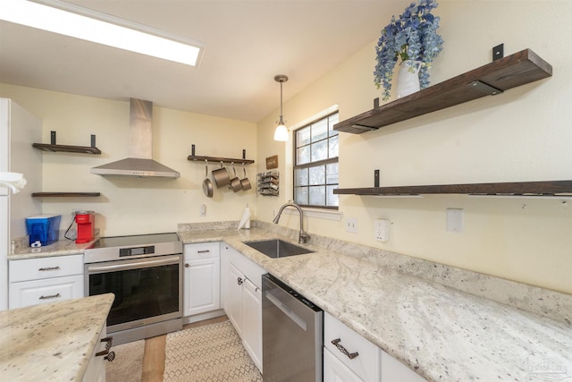 kitchen featuring open shelves, wall chimney exhaust hood, stainless steel appliances, and a sink