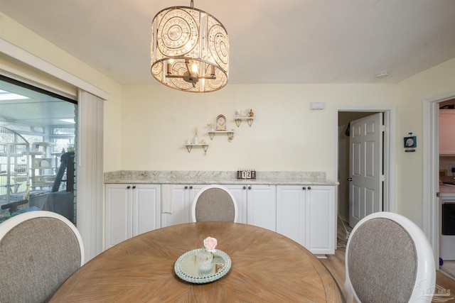 dining space with a chandelier