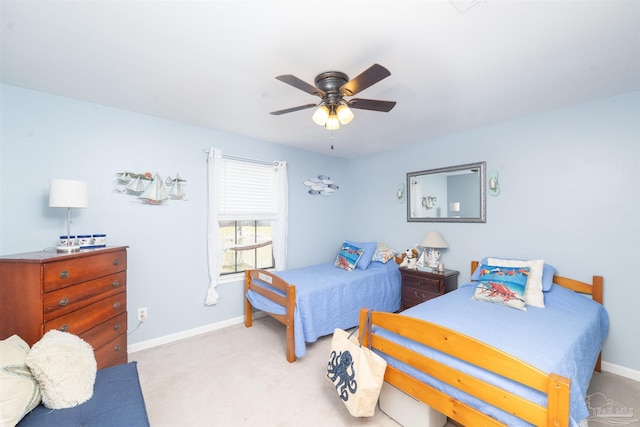 bedroom with light colored carpet, baseboards, and ceiling fan