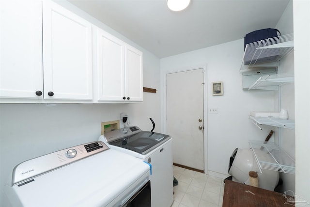 laundry area with washer and dryer and cabinet space