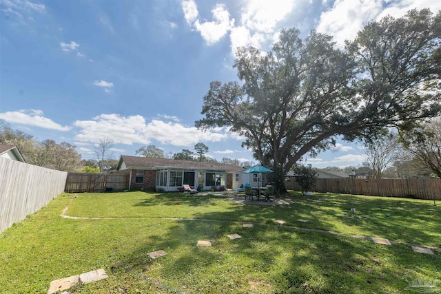 view of yard featuring a fenced backyard and a patio area