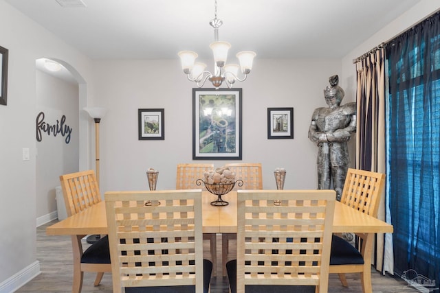 dining area with hardwood / wood-style floors