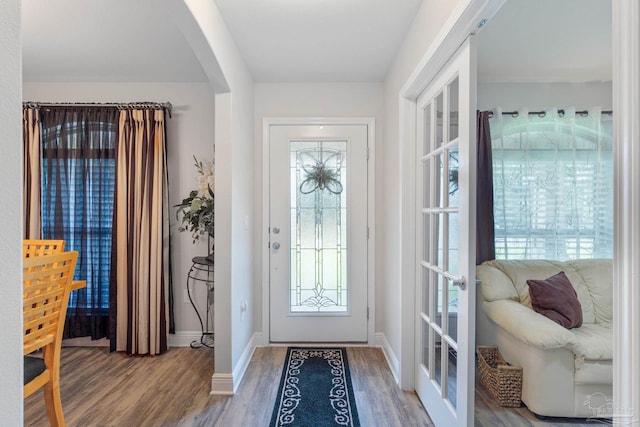 entryway with hardwood / wood-style floors and french doors