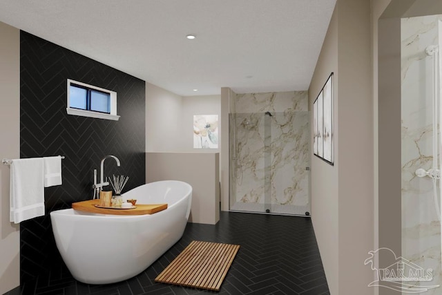 2821 Mandeville Ln, Pensacola, FL 32526 - bathroom featuring tile walls, a marble finish shower, a freestanding bath, plenty of natural light, and recessed lighting
