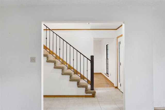 2821 Mandeville Ln, Pensacola, FL 32526 - stairway featuring tile patterned floors and baseboards