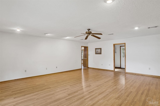 2821 Mandeville Ln, Pensacola, FL 32526 - spare room with ceiling fan, light wood-style floors, a textured ceiling, baseboards, and recessed lighting