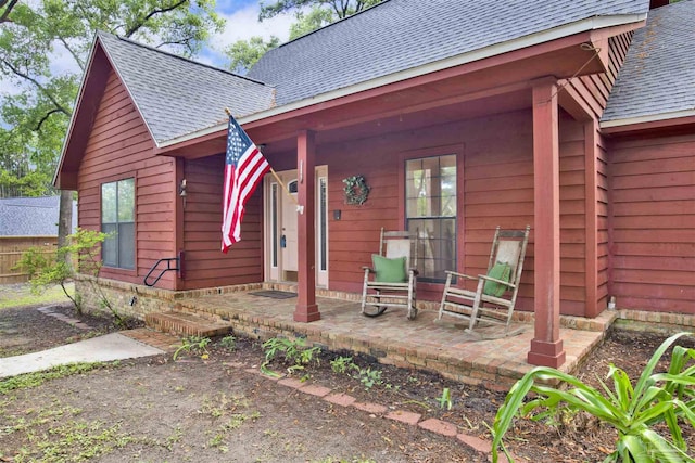 2821 Mandeville Ln, Pensacola, FL 32526 - view of front of property featuring a shingled roof and a porch