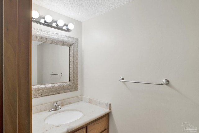2821 Mandeville Ln, Pensacola, FL 32526 - bathroom with a textured ceiling and vanity
