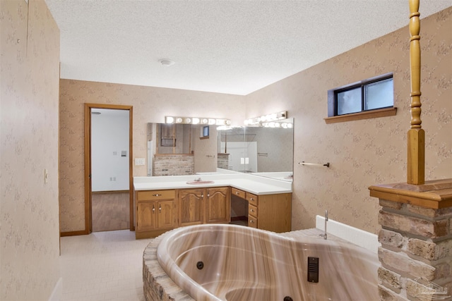 2821 Mandeville Ln, Pensacola, FL 32526 - full bathroom featuring a whirlpool tub, a textured ceiling, vanity, and wallpapered walls