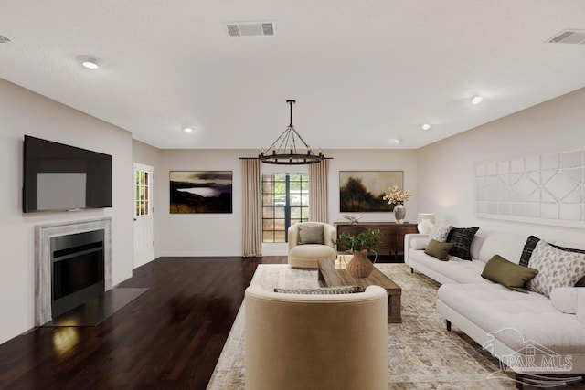 2821 Mandeville Ln, Pensacola, FL 32526 - living area featuring wood finished floors, a fireplace with flush hearth, baseboards, and recessed lighting