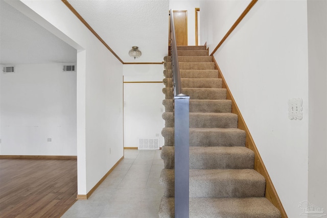 2821 Mandeville Ln, Pensacola, FL 32526 - staircase featuring baseboards and wood finished floors