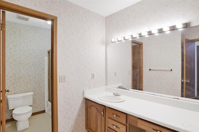 2821 Mandeville Ln, Pensacola, FL 32526 - bathroom with toilet, vanity, and wallpapered walls