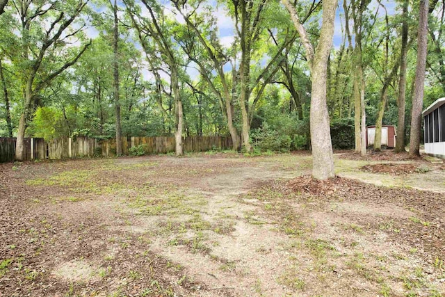 2821 Mandeville Ln, Pensacola, FL 32526 - view of yard featuring fence, a storage shed, and an outdoor structure