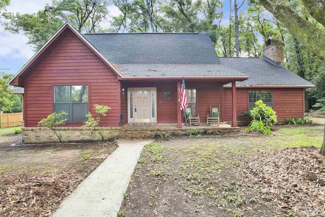 2821 Mandeville Ln, Pensacola, FL 32526 - view of front of home featuring a chimney, roof with shingles, and a porch