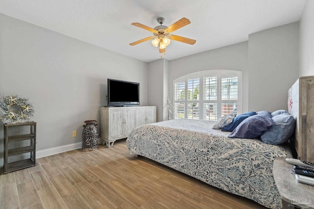 bedroom featuring ceiling fan and light wood-type flooring