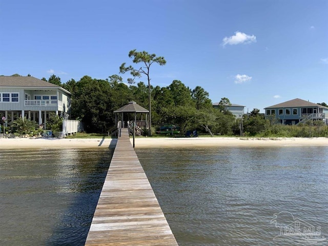 view of dock featuring a water view and a gazebo