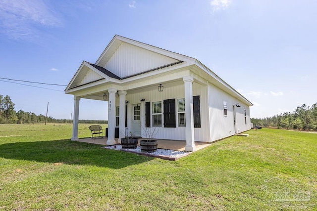 exterior space with a front yard and a patio area