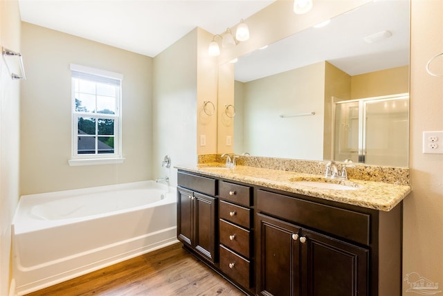 8626 Bucklebury Dr, Pensacola, FL 32507 - bathroom with a bath, wood finished floors, a sink, and a stall shower
