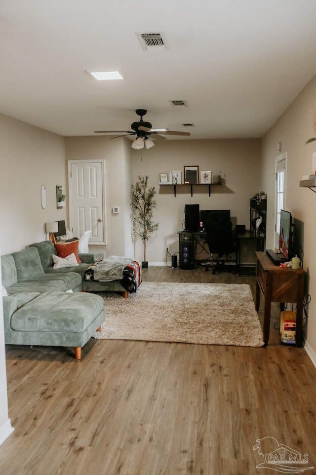 3125 Zepp Ln, Pace, FL 32571 - living area featuring wood finished floors, ceiling fan, and an office area